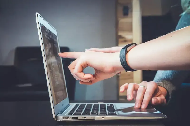 Person reviewing analytics on a laptop